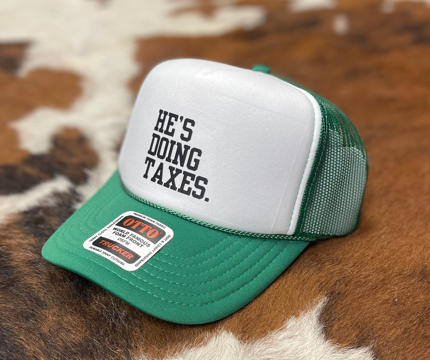 He's Doing Taxes Trucker Hat