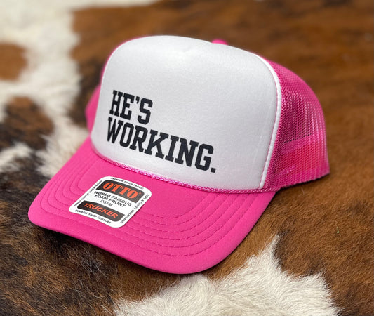 He's Working Trucker Hat